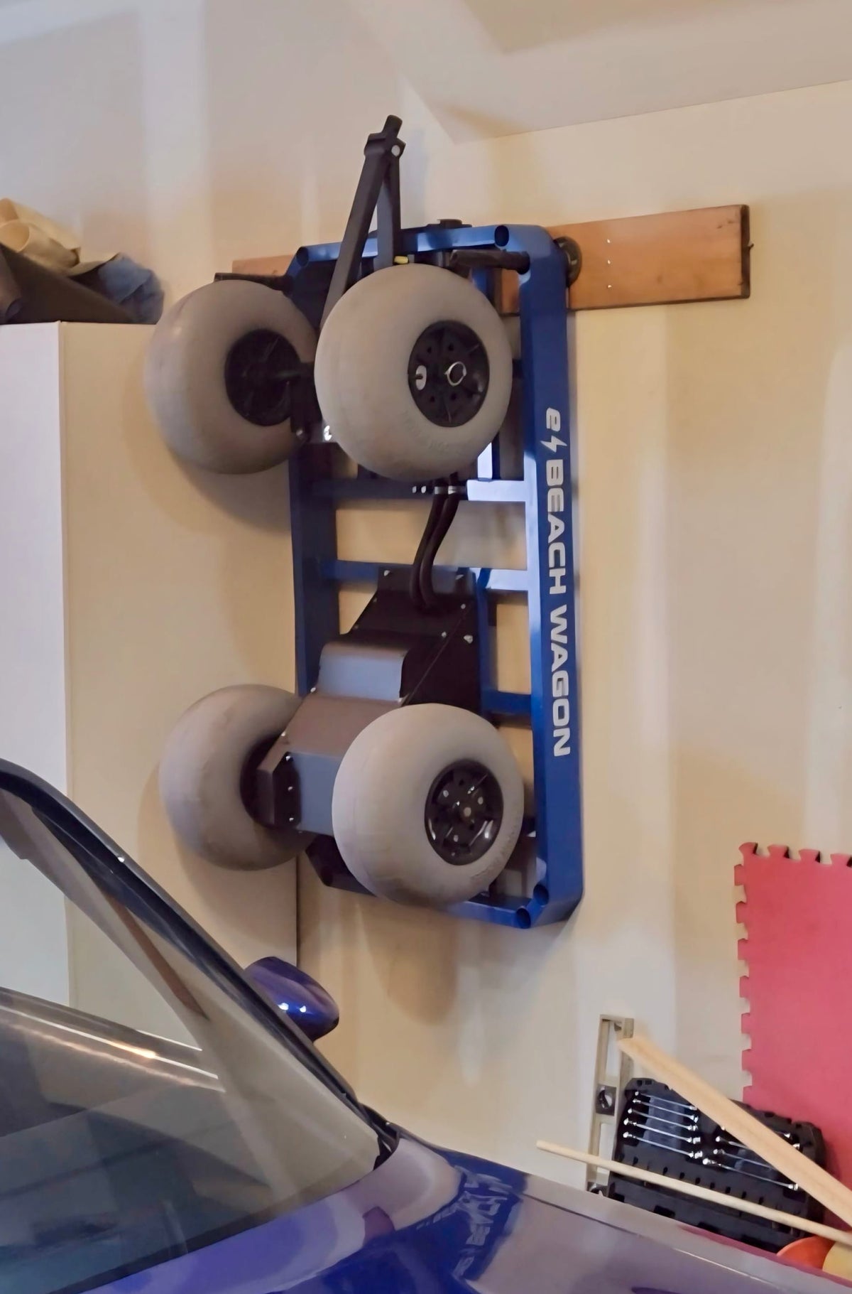 e-Beach Wagon stored upright on garage wall 