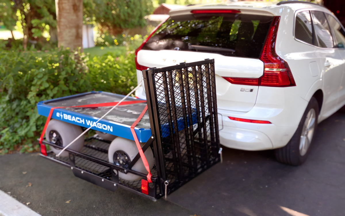 SUV with an e-Beach Wagon attached on a hitch carrier