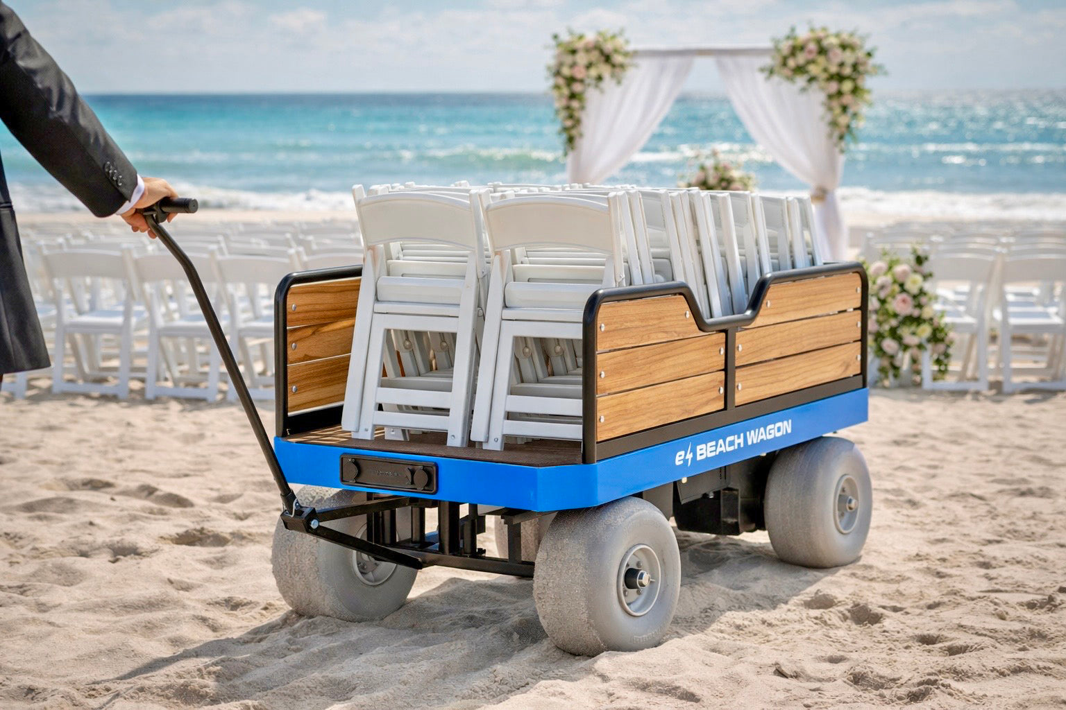 electric beach wagon transporting chairs for a beach wedding ceremony