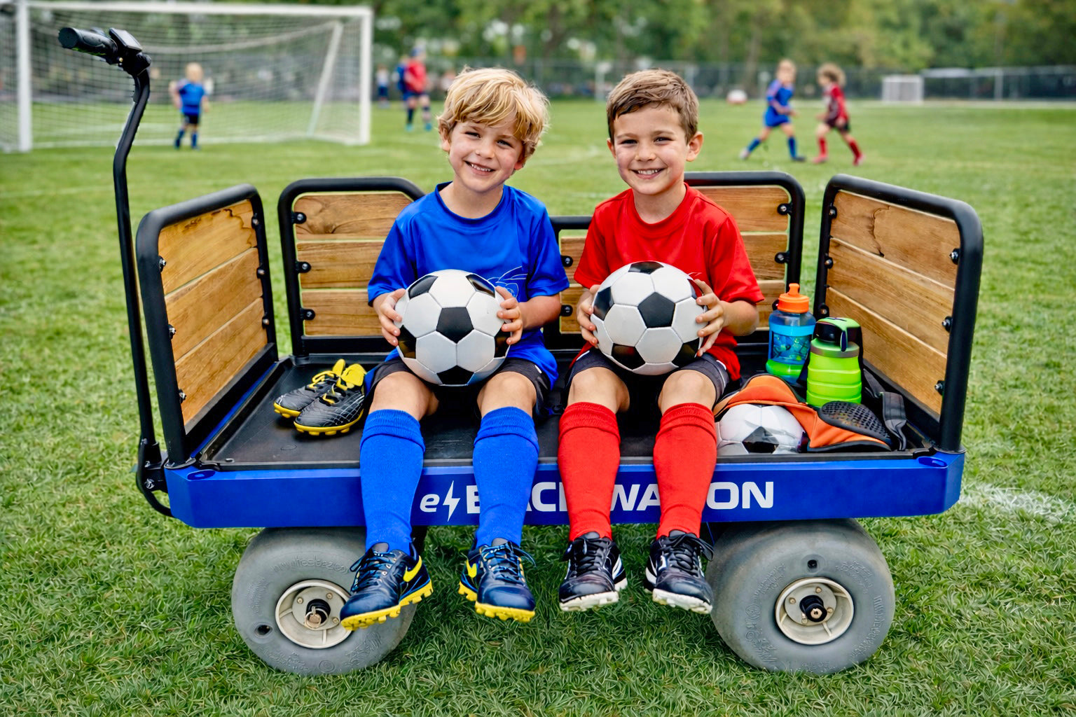 electric wagon carrying kids soccer gear and equipment at a sports field